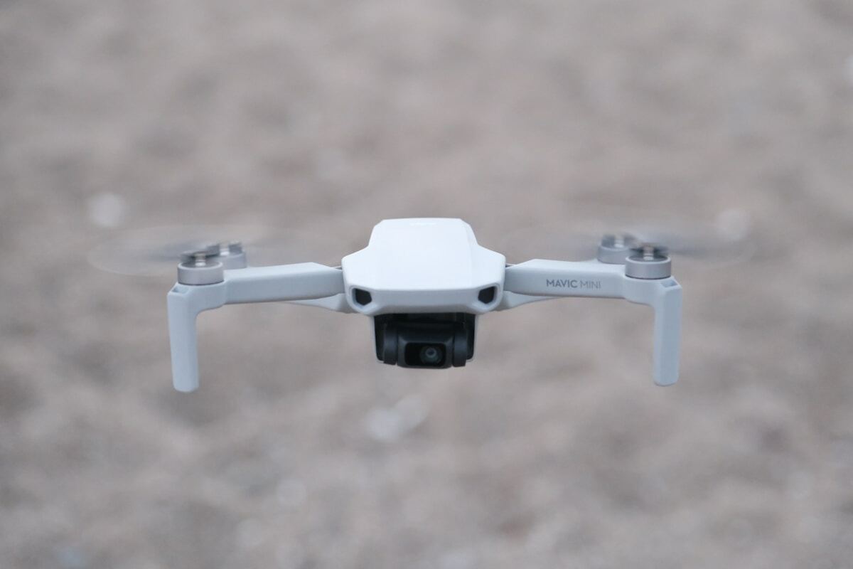 white and gray drone in close up photography