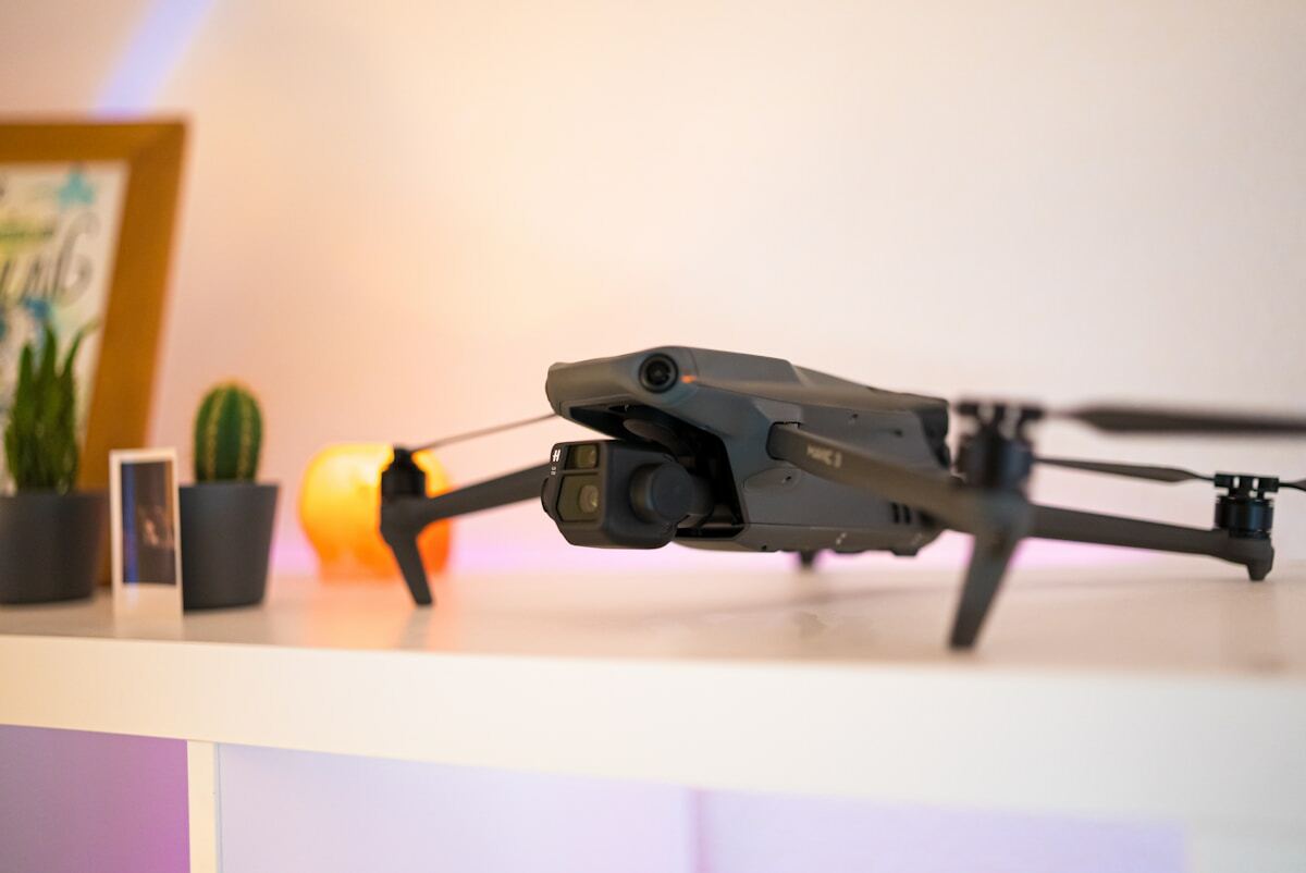 a small black remote controlled flying device on a table
